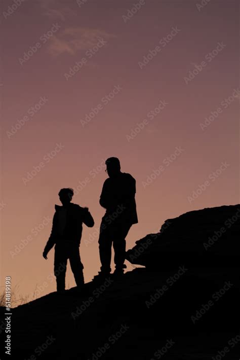 silhouette of a couple on a sunset Stock Photo | Adobe Stock