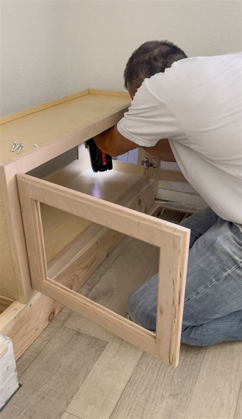 DIY Fireplace Built-Ins Using Kitchen Cabinets