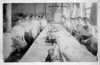 Women employees of the Reliance Waist Co. pose around a wo… | Flickr