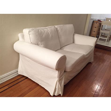 Ikea Ektorp Loveseat with White and Red Slip Covers - AptDeco