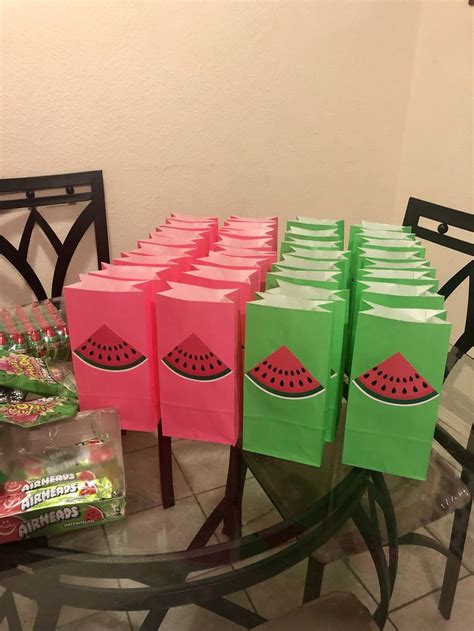 watermelon bags are sitting on a glass table