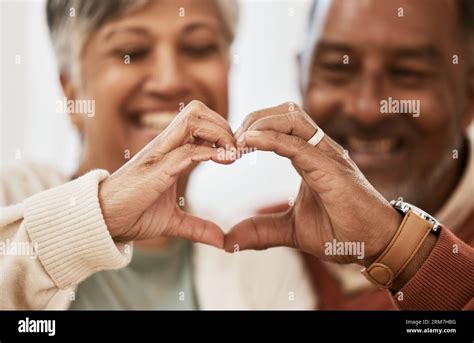Heart, hands and happy senior couple with love, thank you sign or ...