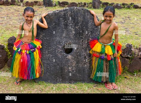 Yapese girls in traditional clothing with stone money at Yap Day Festival, Yap Island, Federated ...