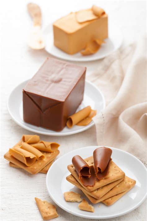 Different kinds of Norwegian brown cheese. Traditional brunost from Norway. Voyage Suede ...