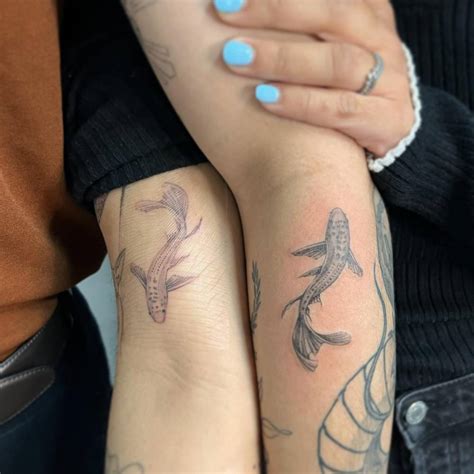 Yin and Yang koi fish couple tattoo.