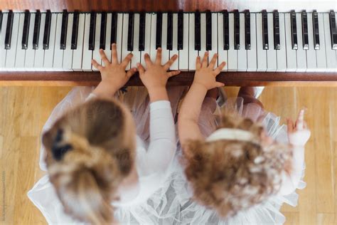 "Little Girls Practicing The Piano" by Stocksy Contributor "Boris ...