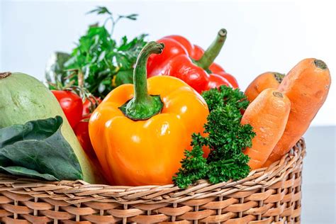 Wicker basket in the shape of a heart filled with fresh vegetables and herbs - Creative Commons ...