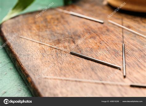 Acupuncture Needles Wooden Board Closeup Stock Photo by ©serezniy 468616286