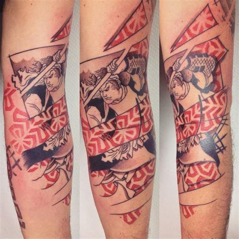 Graphic samurai tattoo on the arm.