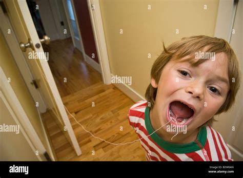 Isaac Lamont age 6 attempts to pull a loose tooth using the age old ...