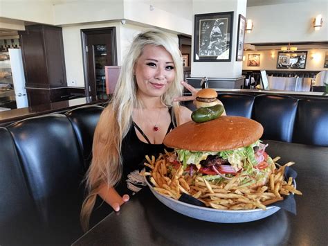 Watch A Record-Holding Competitive Eater Take On This 10-Pound OMG Burger Challenge