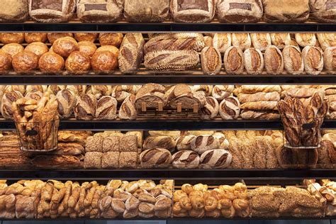 Bakery shelf with many types of bread. Tasty german bread loaves on the ...