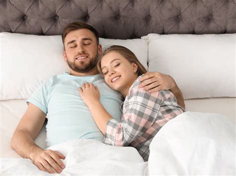 Young Couple Sleeping Together in Bed Stock Photo - Image of ...