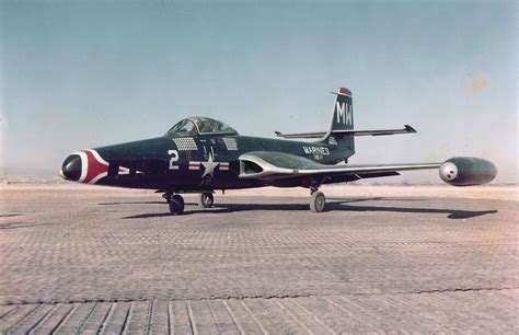 McDonnell Douglas F2H-2P Banshee from VMJ-1 parked on a runway at an air base in Korea, during ...