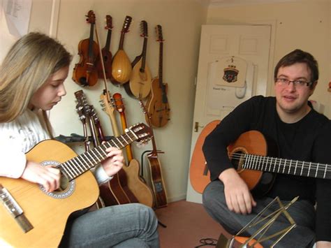 Jess at guitar lesson | I know which one of these two has th… | Flickr