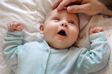 Premium Photo | Father with his daughter tiny infant newborn baby smiling laughing and looking ...