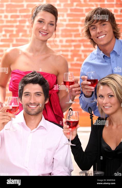 Friends drinking wine Stock Photo - Alamy