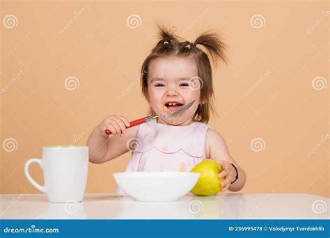 Cute Funny Babies Eating, Baby Food. Funny Smiling Baby Girl with Spoon ...