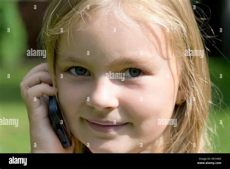 Cute girl talking by cellular Stock Photo - Alamy