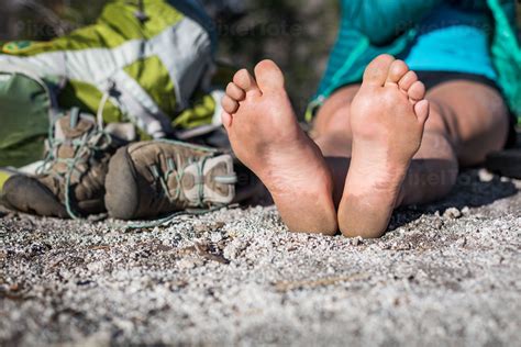 Bare Feet of a Woman Resting Stock Photo - PixelTote