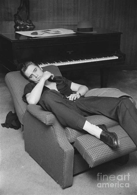 Elvis Presley at home by his piano 1956 Photograph by The Harrington ...