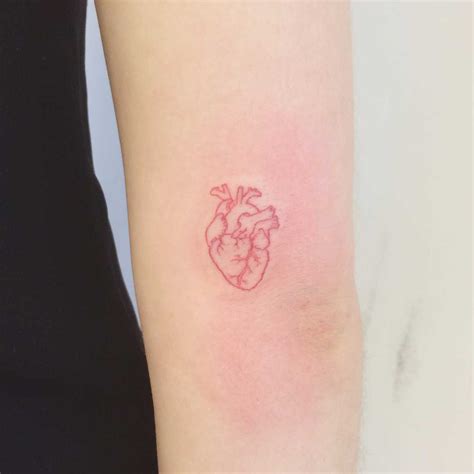 A tiny red heart tattoo by Annelie Fransson - Tattoogrid.net