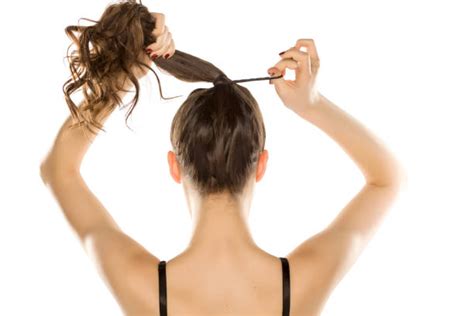 Woman Tying Hair Up Stock Photos, Pictures & Royalty-Free Images - iStock