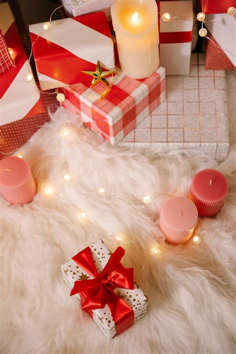 Gift boxes with candles and garland · Free Stock Photo