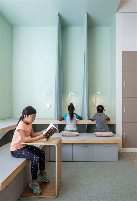 A+I designs New York City school with colourful panels and tiered ...