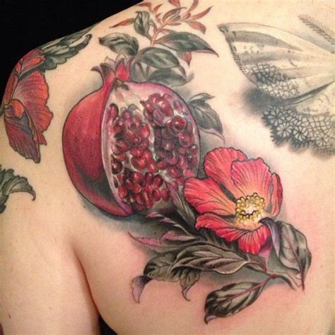 A pomegranate is a powerful symbol of fertility and promise. This beautiful tattoo design comes ...