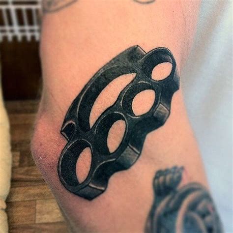 Brass Knuckles Tattoo On Hand