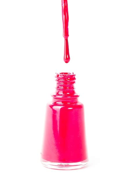 Premium Photo | Red nail polish with brush closeup isolated