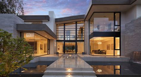 Home with Glass Screen and Water Features in Entry Courtyard