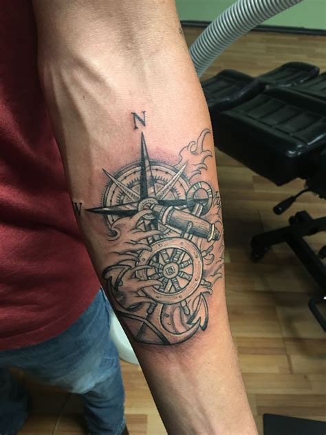 An Anchor And Compass Tattoo On The Thigh - vrogue.co
