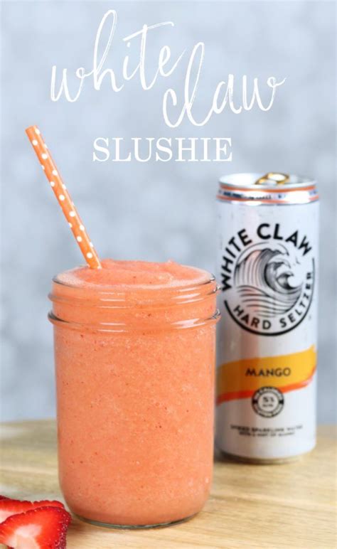 a strawberry smoothie in a mason jar next to a can of white claw slushie