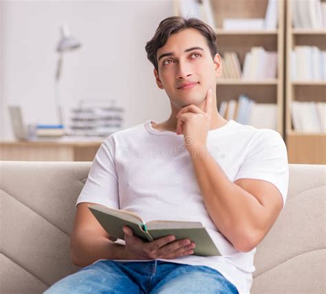 Man Reading Book Sitting In Couch Sofa Stock Photo - Image of ...