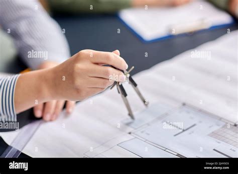 architect with blueprint and drafting compass Stock Photo - Alamy