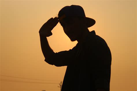 1366x768 wallpaper | silhouette of man wearing fitted cap | Peakpx