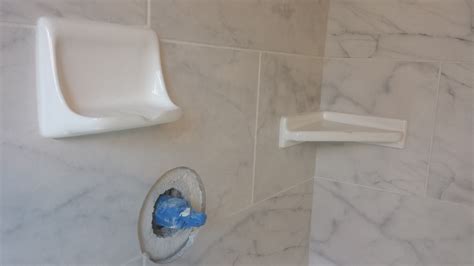 Our clients decided to use white ceramic corner shelves and soap dishes. Very common and they ...