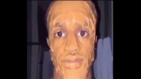 black man face covered in peanut butter looking at the camera ominously - YouTube