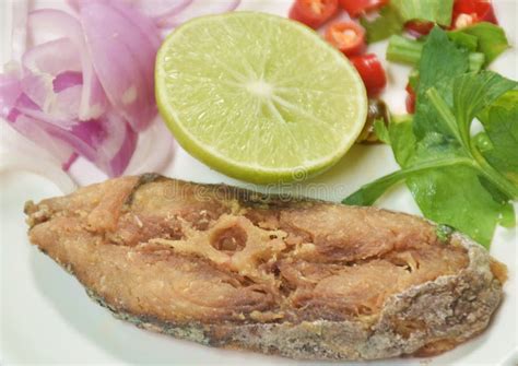 Salty Dry Indo-Pacific King Mackerel Fish Topping Chop Shallot and Chili with Slice Lemon Salad ...