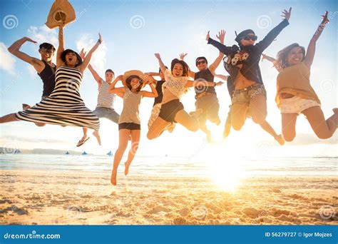 Jumping at the beach stock image. Image of nature, joyful - 56279727
