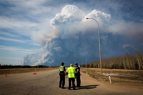 Alberta wildfire moves south, forcing more evacuations in Canada's oil ...