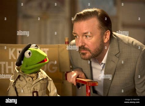 "MUPPETS MOST WANTED" (L-R) KERMIT THE FROG and DOMINIC BADGUY (Ricky Gervais). Ph: Jay Maidment ...