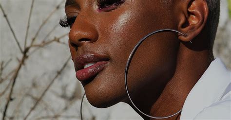 Portrait of a Woman Wearing Silver-colored Hoop Earrings · Free Stock Photo