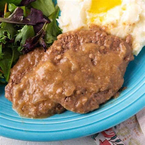 Cube Steak with Onion Gravy is an easy dinner recipe. Tenderized beef steaks braised in ...