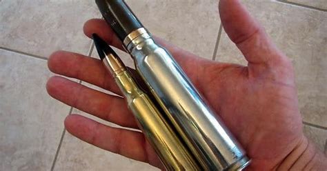 The small bullet is a .50 BMG, the larger one is the 20MM rifle round. : r/pics