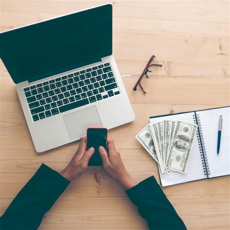 Premium Photo | Cropped image of business person working at desk in office