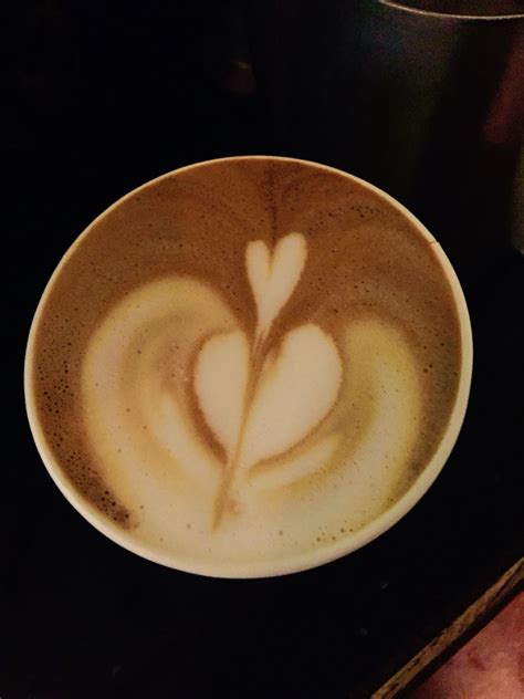 a coffee cup with a heart drawn in it