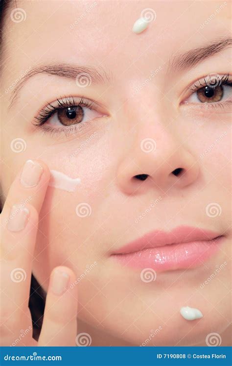 Woman applying creme stock photo. Image of face, health - 7190808